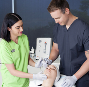 A trainer guiding a student through practical training at the training clinic on the Gold Coast