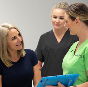 A trainer consulting a training client at our clinic on the God Coast
