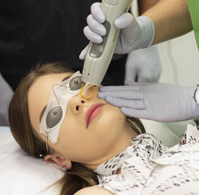 A client receiving laser at the training clinic on the Gold Coast